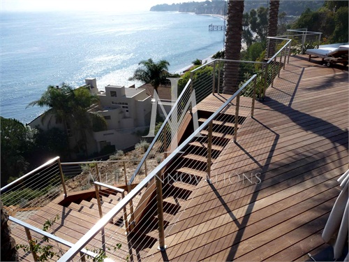 <p>This a stainless steel cable rail that is surface mounted at a home on Sea Lane Drive in Malibu over looking Paradise Cove. The rails are installed on a Ipa wood deck</p>
