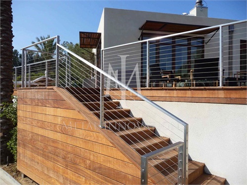 <p>This is a stainless steel cable rail that is surface mounted at a home on Sea Lane Drive in Malibu over looking Paradise Cove. The rails are installed on a Ipa wood deck</p>
